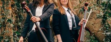 Image of two ladies with instruments