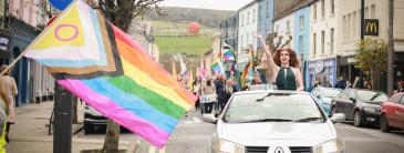 Brightly coloured flag and parade