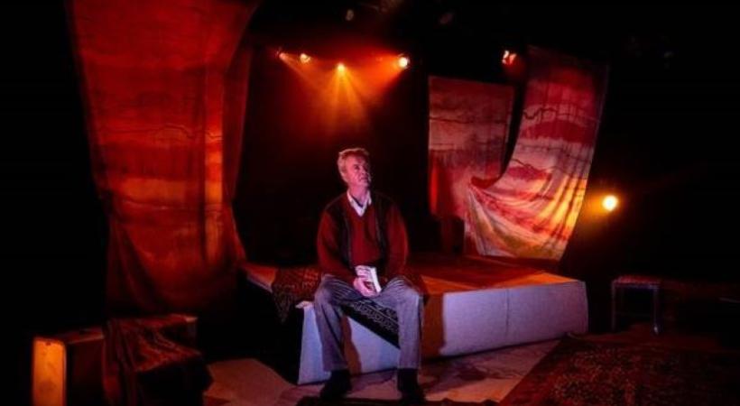 Man sitting on a stage