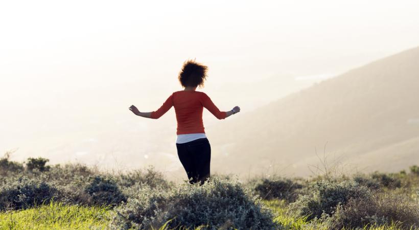 Lady on a grassy hillside