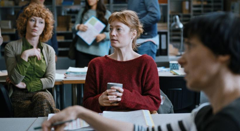 Woman sitting with a cup of tea