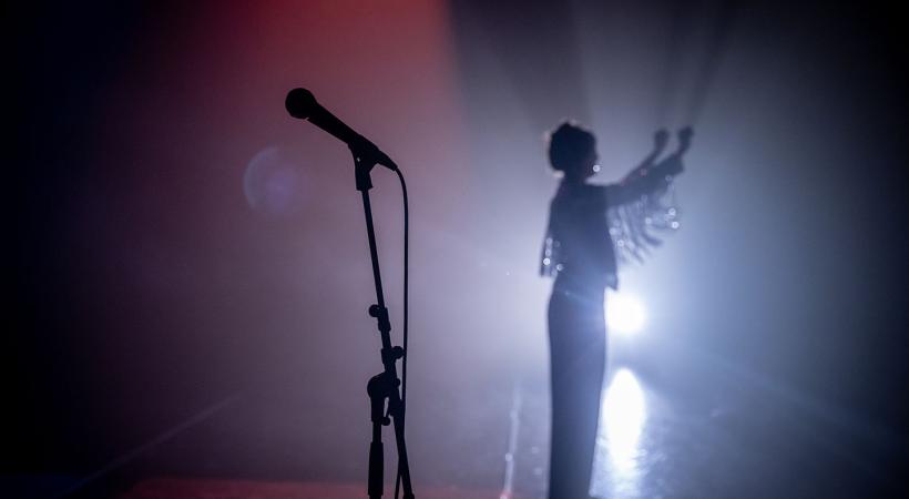 Microphone with woman in background